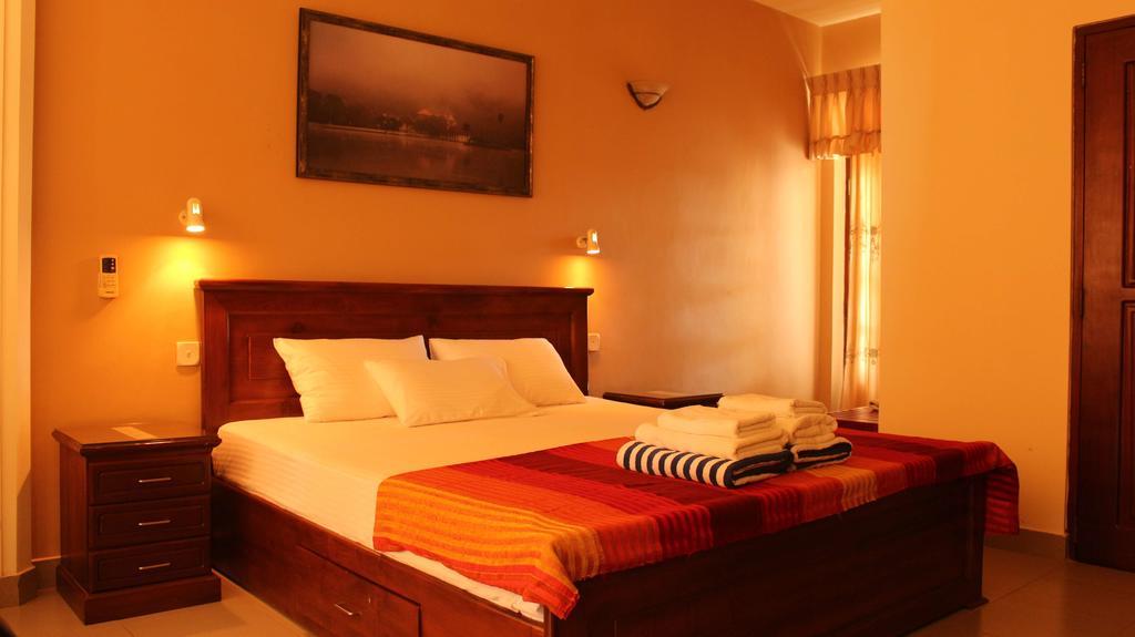 Janishi Residencies Hotell Negombo Rom bilde